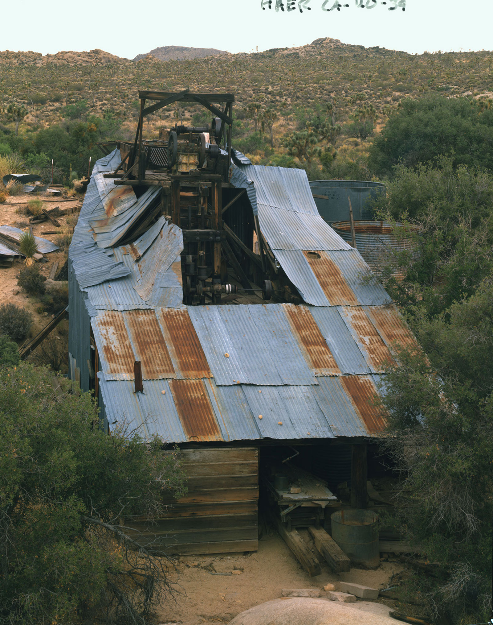 General view of mill structure showing headworks with slurry table at bottom - Wall Street Gold Mill, Twentynine Palms, San Bernardino County, CA