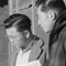 Roy Takeno (Editor) and Group Reading Manzanar Paper [i.e. Los Angeles Times] in front of office, Yuichi Hirata, Nabuo Samamura