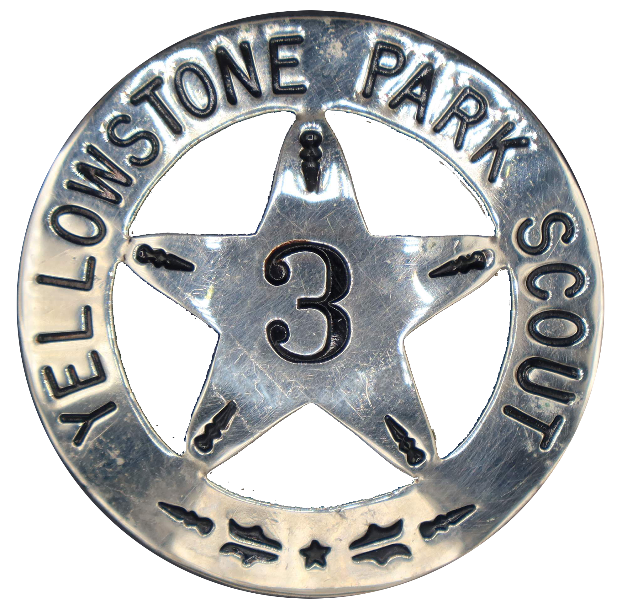 Round silver badge with a central five-point star marked with the number 3. The rim is marked Yellowstone park scout.