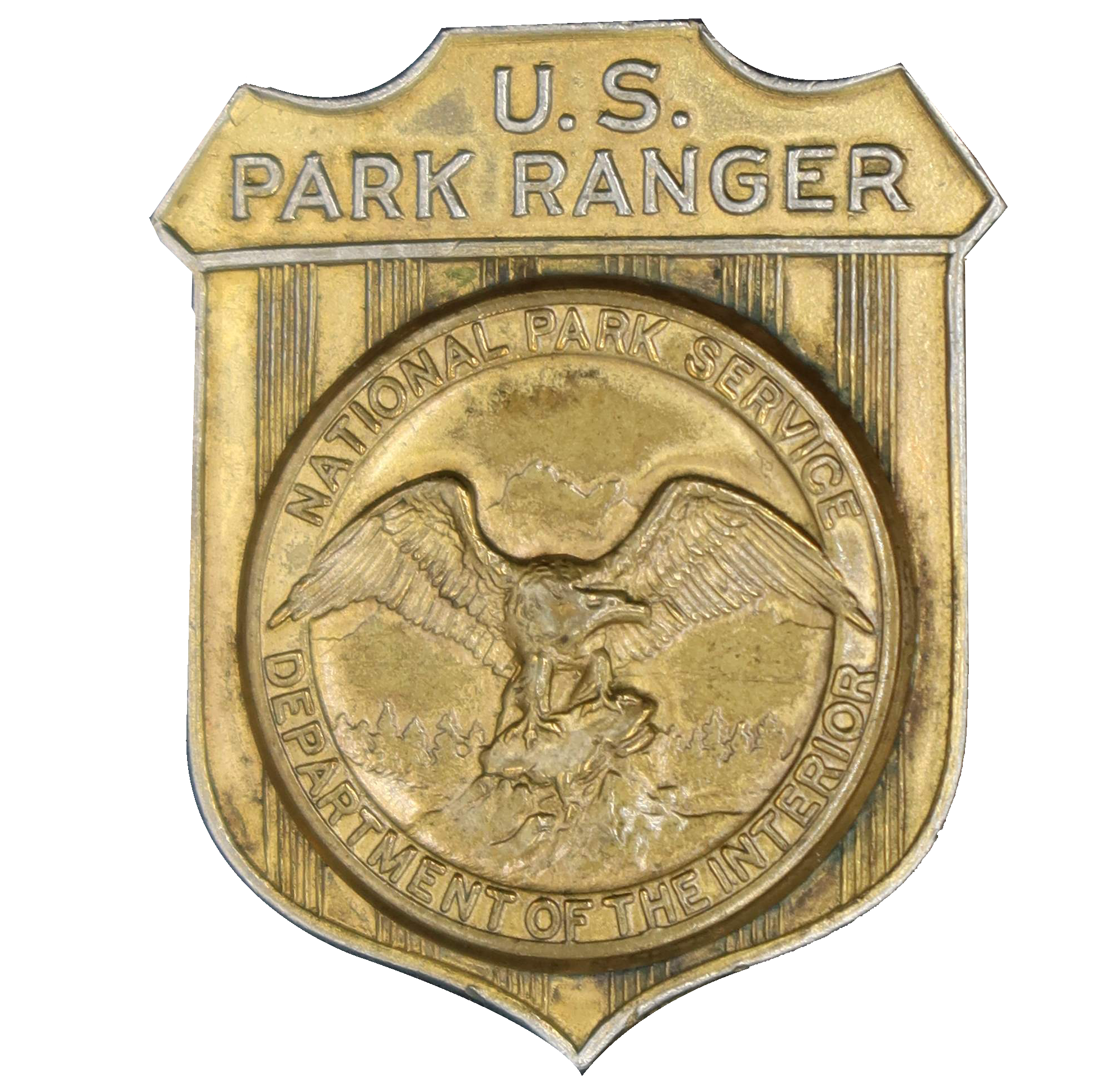 Gold shield-shaped badge marked U.S. Park Ranger. The raised round seal in the middle has an eagle looking to its left.