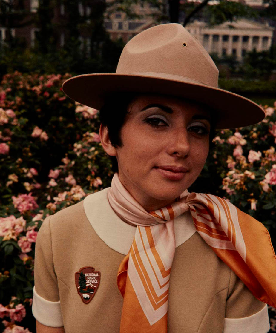 Carol Scanlon models the beige NPS women’s uniform dress, scarf, and broad brim hat. The uniform has an arrowhead patch instead of a ranger badge.