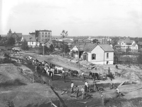 Photograph shows Students digging the foundation for the C.P. Huntington Memorial Building at Tuskegee Institute 

