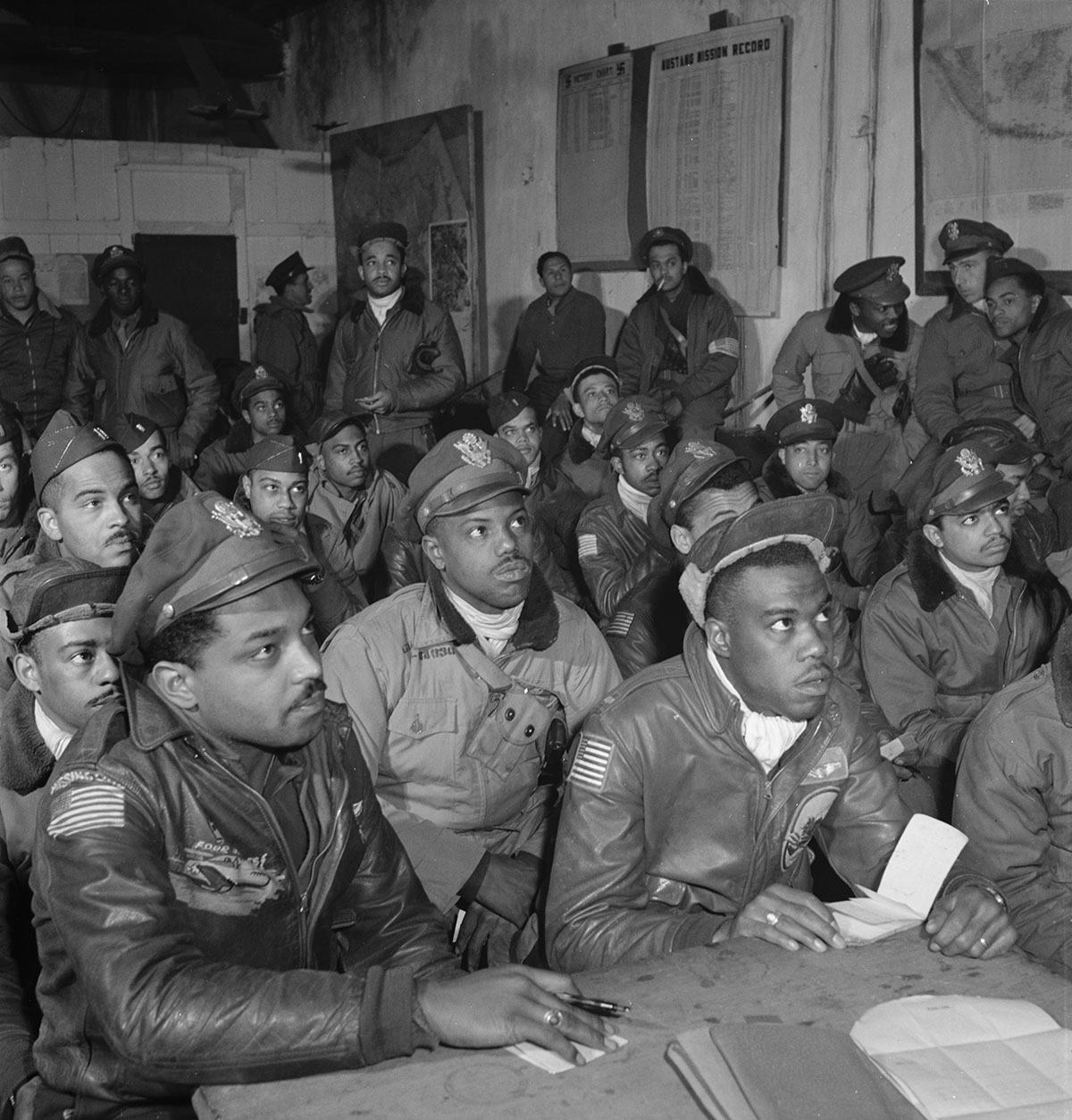 Photograph of 
Tuskegee Airmen attending a briefing at Ramitelli, Italy