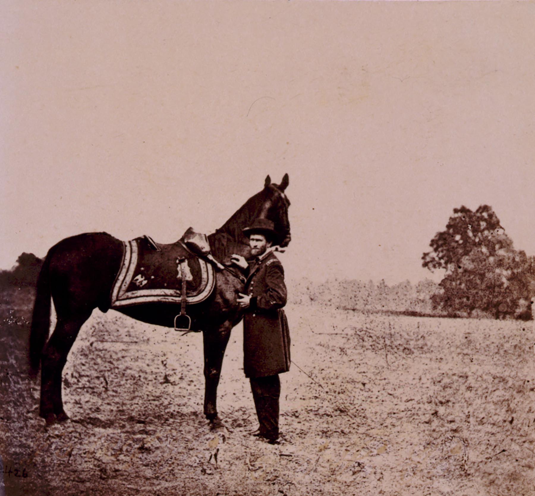 Ulysses S. Grant, full-length portrait, facing left, standing alongside his war horse, Cincinnati