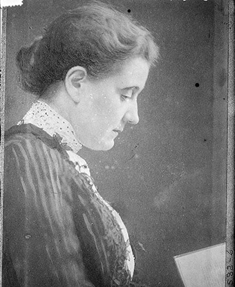 Side Portrait of Jane Addams reading a book, ca. 1899.