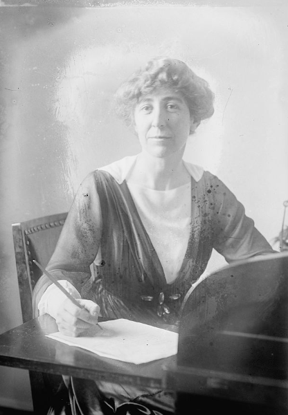 Janette Rankin writing at a table