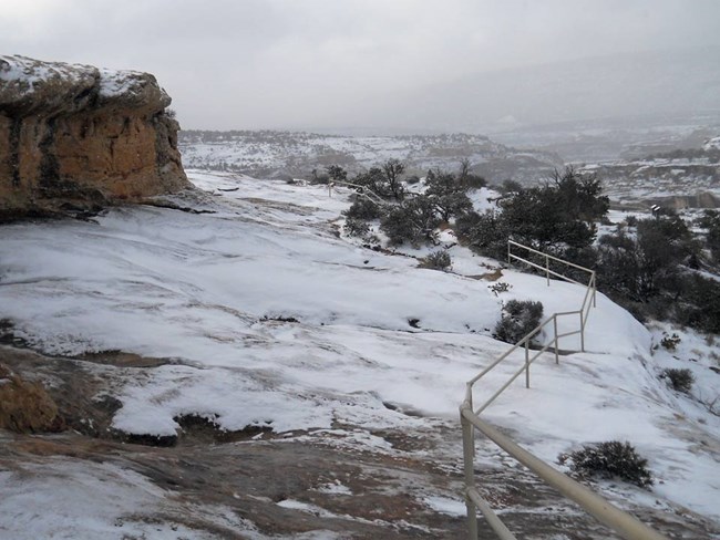 Slickrock trail to Horse Collar Ruin Overlook covered in snow and ice