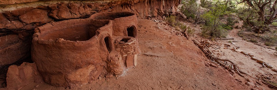 two circular structures with small doorway openings