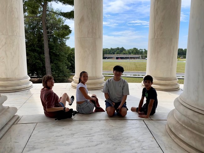 Youth Program participants sitting at Jefferson Memorial