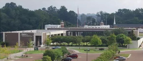 large modern building and adjacent parking lot