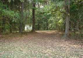 To find the bicycle-only campground, look for the open area near the small white building.