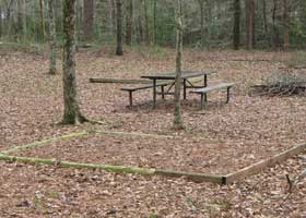 Picnic table and tent pad at the Kosciusko Bicycle only campground. Picnic table and tent pad at the Kosciusko Bicycle only campground.