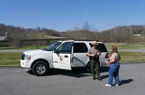 A Park Ranger helps answer visitor questions while traveling on the Natchez Trace Parkway. A Park Ranger helps answer visitor questions while traveling on the Natchez Trace Parkway.