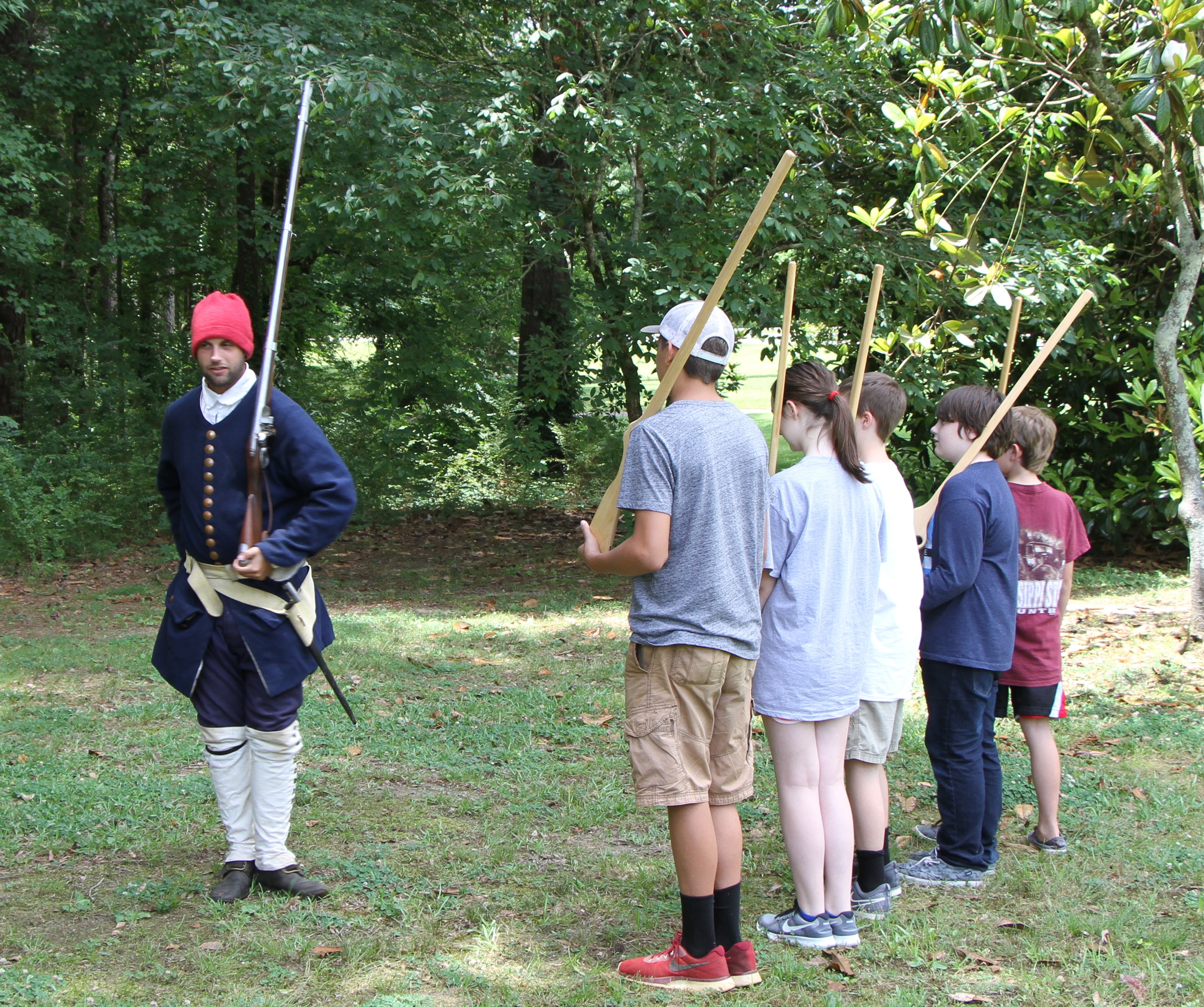 Public Historian Brian Mast, from the University of West Alabama, leads junior rangers in French Marines marching drills.