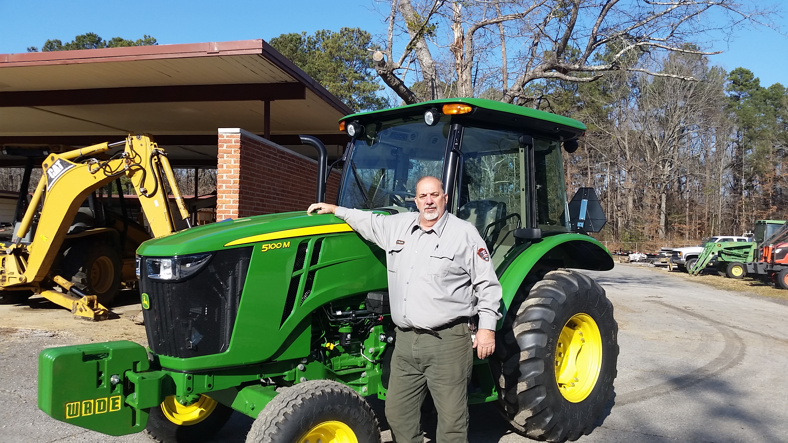 Michael Phillips stands by one of the many tractor’s he operated and maintained at the Parkway.