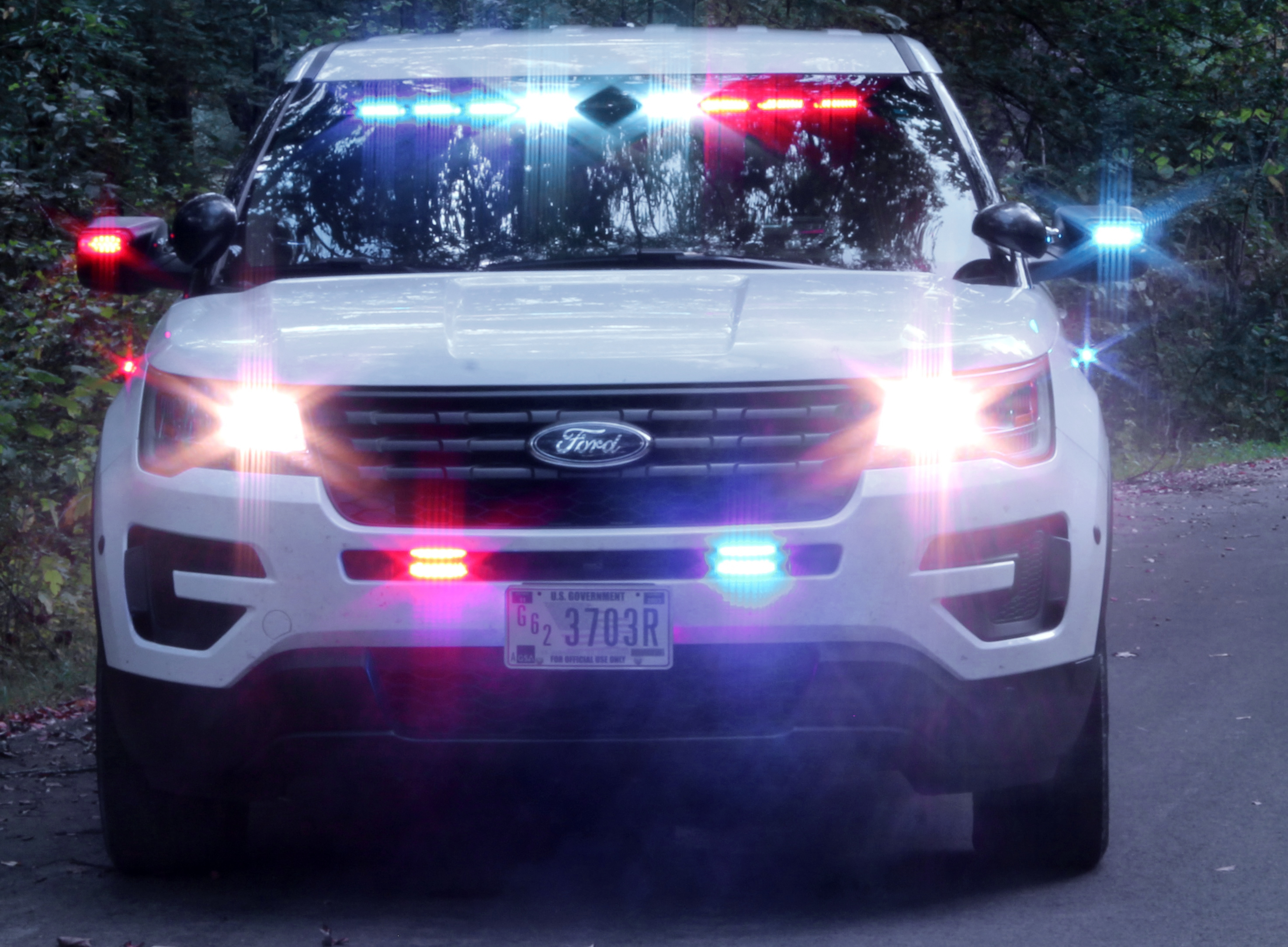 Park Rangers made 8,557 traffic stops in 2022 Front end of white patrol vehicle with emergency lights on
