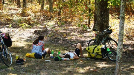 Bicyclists resting in the shade Bicyclists resting in the shade