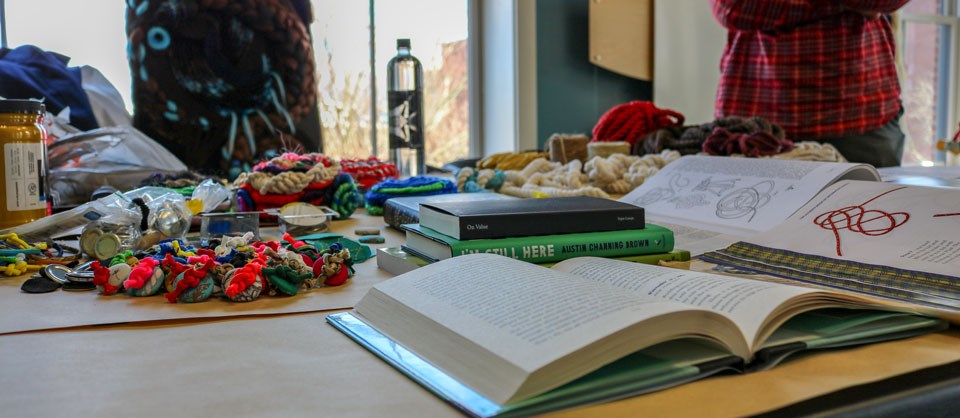 Colorful display of books, ropes and threads