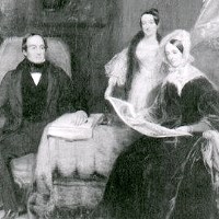 James, Elizabeth, Sarah Arnold family gathered in a living room.