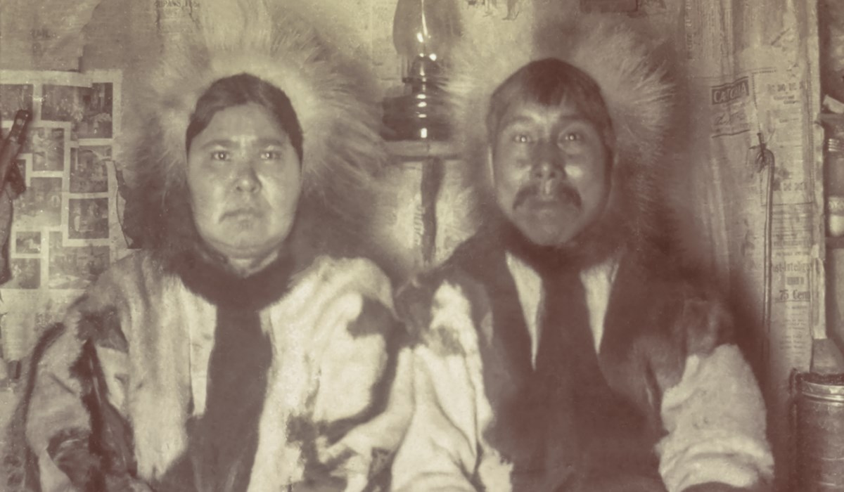 Photograph of two natives dressed in furs.