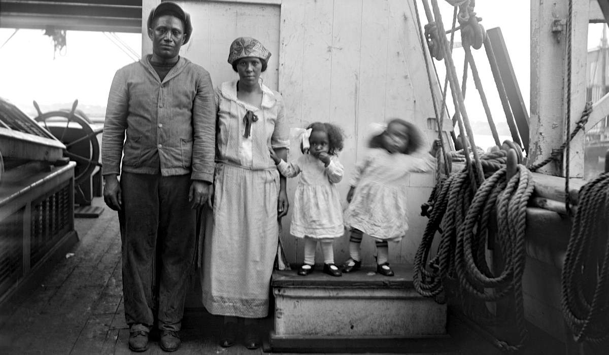 Seaman poses with wife and two daughters onboard.