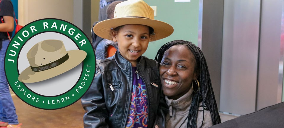 Young girl and her mom smiling as they become Junior Rangers