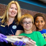 Kids from Something Fishy Camp 2014 holding a fish Kids from Something Fishy Camp 2014 holding a fish