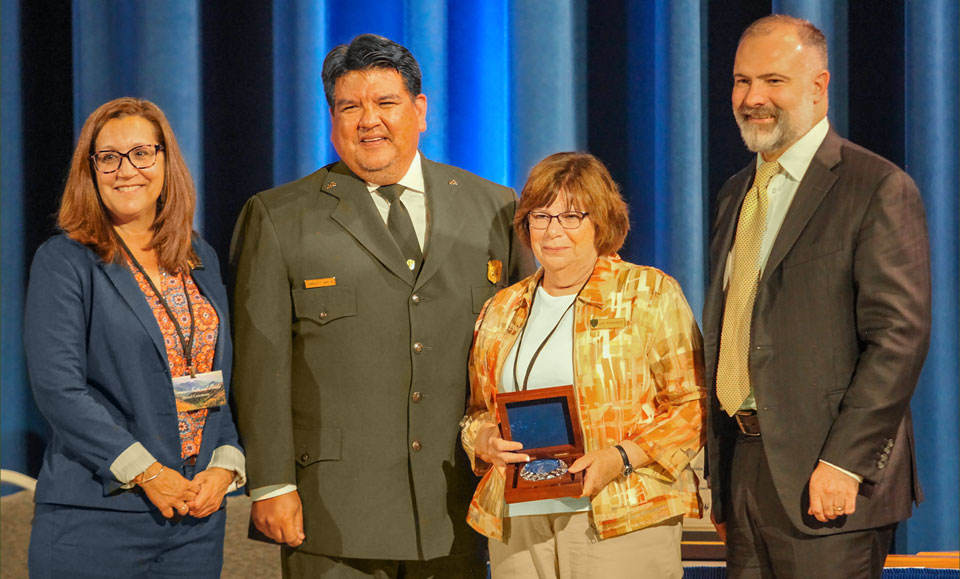 Judy Roderiques receives her Hartzog award