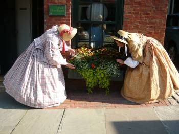 Ruth and abby tend flowers