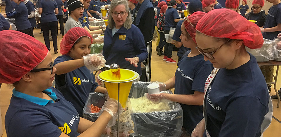 Students from Youth Leadership Academy helping at a UMass Dartmouth