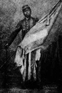A black and white rendering of Sgt. William Harvey Carney holding the U.S. Flag.