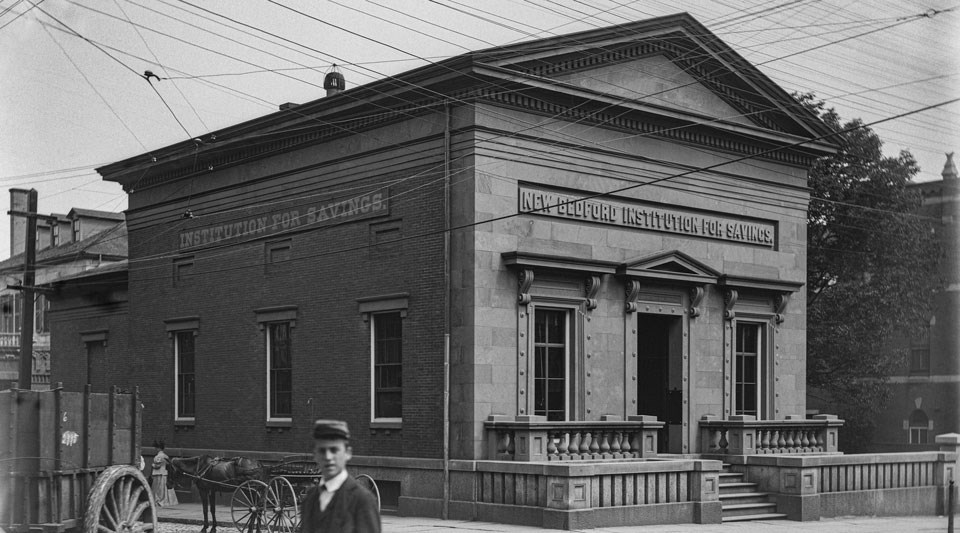 Historic photo of the Visitor Center with a man staring at the camera