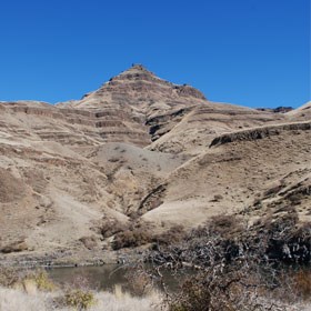 A rocky and dusty mountain top on a sunny day.