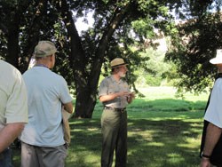 A male ranger leading a walking tour.