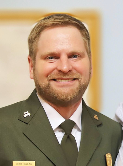 Portrait of a Caucasian appearing man in NPS uniform from the chest up.