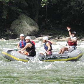 teens rafting on the river