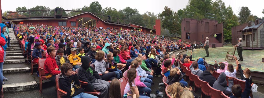 theater full of students with rangers on stage theater full of students with rangers on stage