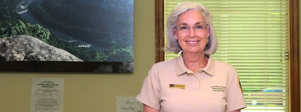 Volunteer behind the information desk