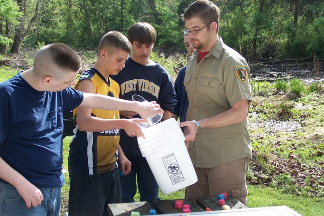 Volunteer assists with environmental education program