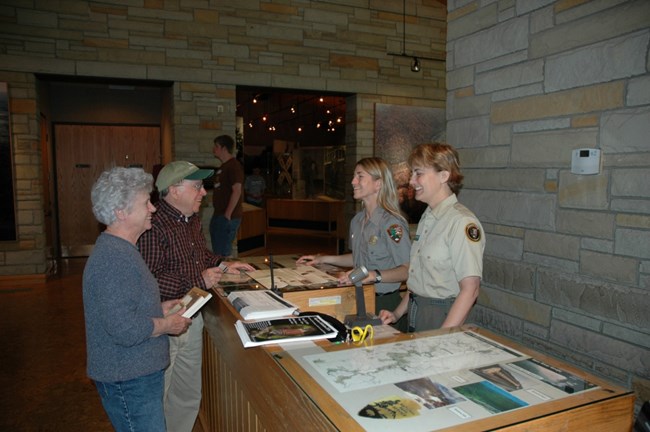Volunteer assisting at visitor center