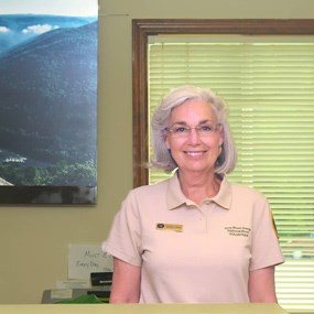 Volunteer behind information desk