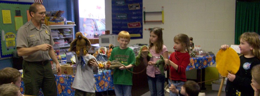 ranger and students demonstrating a food chain