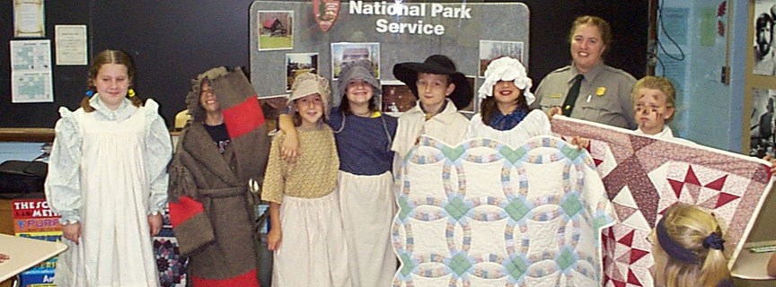 ranger and students dressed in period clothing