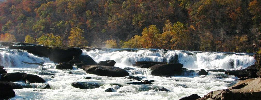 wide waterfall spanning river