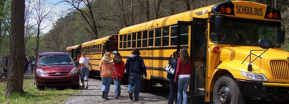 students gettong on school bus