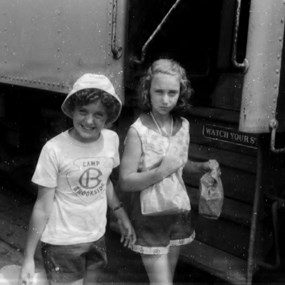 girls getting off train