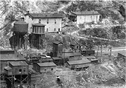 historic photo of water tanks along RR tracks