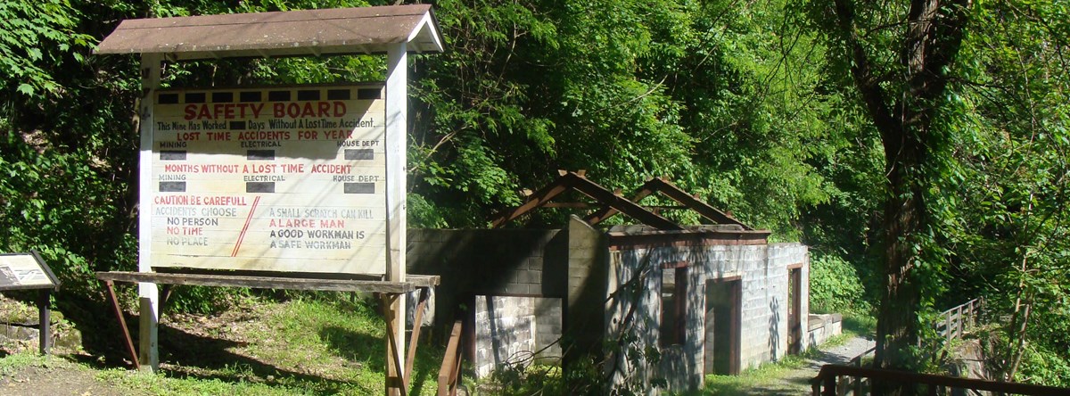 Historic signage and building ruins of Kaymoor Mine Site