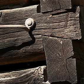 close up of chestnut log barn wall