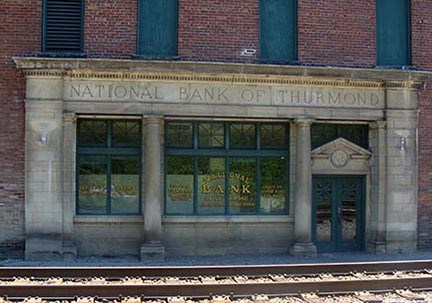 brick bank building along RR track